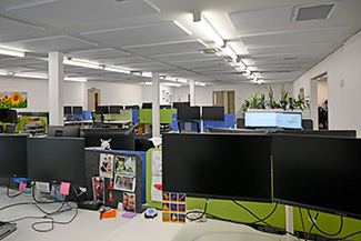 Ceiling acoustic panels in a large call centre.